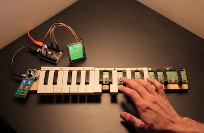 'yay brain', a deconstructed midi keyboard connected to a small LCD screen, installed at the 2018 SFPC spring student showcase.