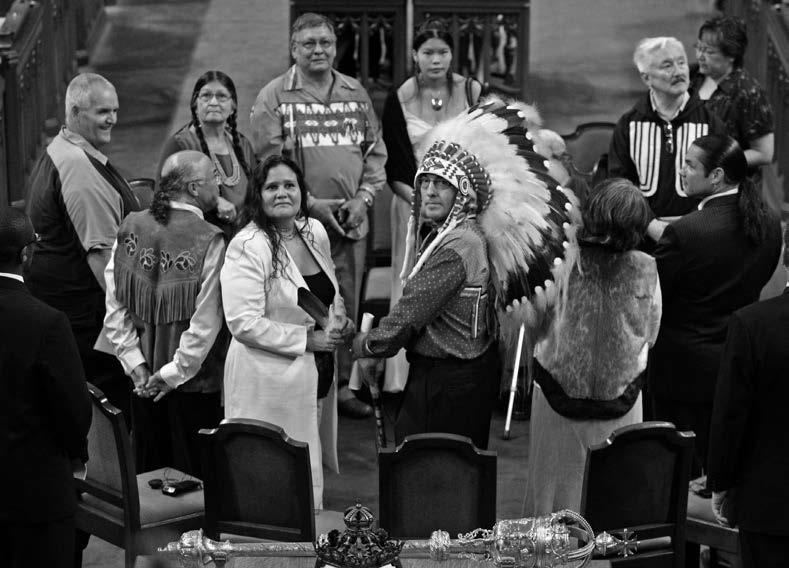 Canada’s Aboriginal leaders along with a number of former residential schools students were present on the floor of the House of Commons when Prime Minister Stephen Harper delivered his 2008 apology. Clockwise from the left: former student Don Favel; former student Mary Moonias; former student Mike Cachagee, President of the National Residential School Survivors Society; former student Crystal Merasty; former student Piita Irniq; Patrick Brazeau, National Chief of the Congress of Aboriginal Peoples; Mary Simon, President of the Inuit Tapiriit Kanatami; Phil Fontaine, National Chief of the Assembly of First Nations; Beverley Jacobs, President of the Native Women’s Association of Canada; Clem Chartier, President of the Métis National Council. Former student Marguerite Wabano is obscured by Phil Fontaine’s headdress. Canadian Press: Fred Chartrand.